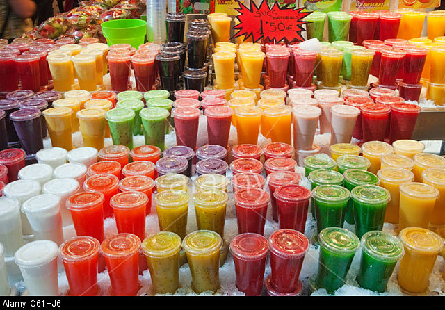 Spain, Barcelona, Las Ramblas, La Boqueria Market, Fruit and Fruit Juice Stall Display
